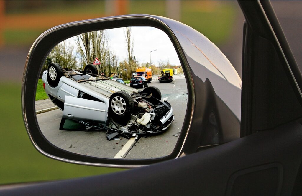 Broken car in the reflection of the mirror